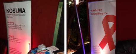 Banner von der AIDS-Hilfe Heidelberg und KOSI.MA. Auf einem Stehtisch liegen verschiedene Materialien.
